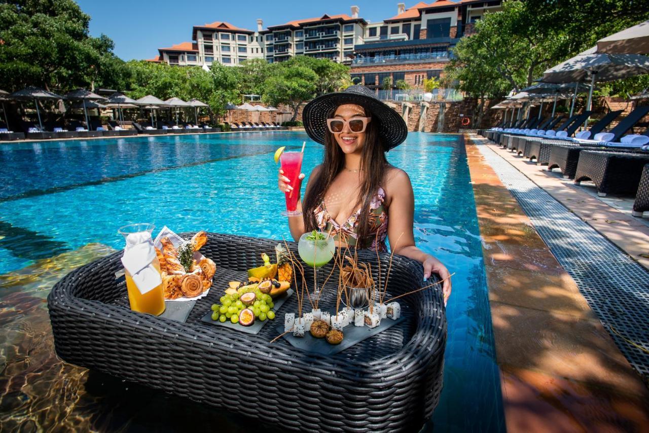 Hotel The Capital Zimbali Ballito Esterno foto Poolside at the hotel